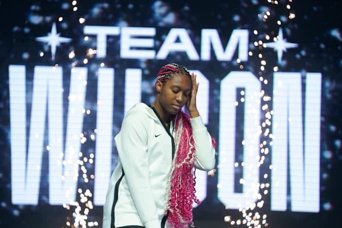 Aliyah Boston poses on stage during player introductions prior to the 2023 WNBA All-Star Game.